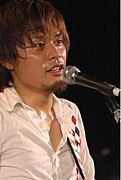 聞間拓